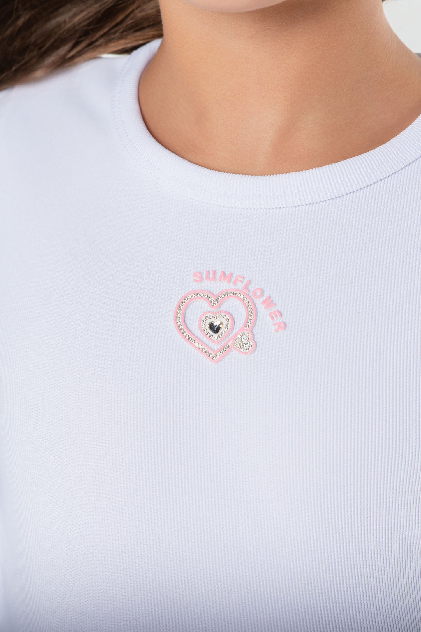 Blusa rib para niña con aberturas y moños laterales