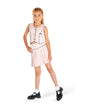 Conjunto rosa con chaleco y falda plisada